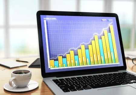 Business chart on laptop screen with cup of coffee on wooden tableの写真素材