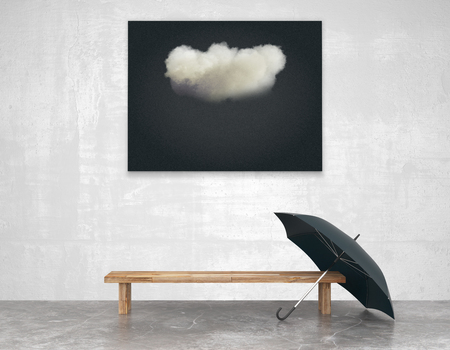 Interior art with a bench and a black picture of a cloud and umbrellaの写真素材