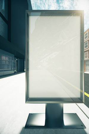 Blank rectangular billboard on sunny city street, mock upの写真素材