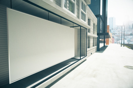 Blank white billboard instead showcase on the building, mock upの写真素材