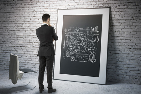 Research concept with businessman looking at business scheme on black frame. 3D Renderの写真素材