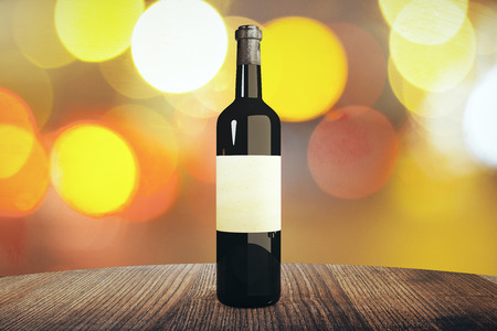 Wine bottle with blank label on wooden table, with blurry lights in the background. Mock up, 3D Renderingの写真素材