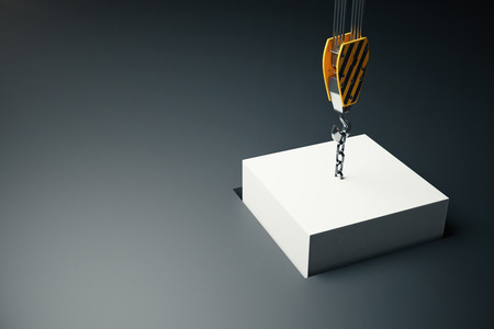 White block hanging on crane hook going into hole on dark background. 3D Rendering