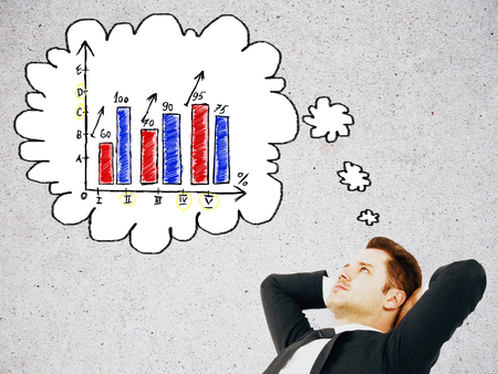 Relaxed businessman with business chart on his mind on concrete backgroundの写真素材