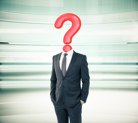 Businessman with question mark head on abstract green backgroundの写真素材