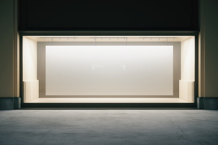 Front view of shop exterior with large banner in empty showcase at night. Mock up, 3D Renderingの写真素材