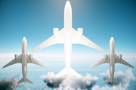 Bottom view of three airplanes on blue sky background with sunlight. 3D Renderingの写真素材