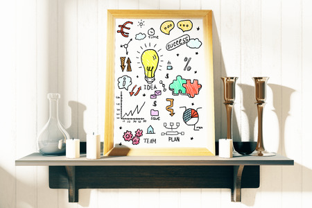 Front view and closeup of decorative shelf with business sketch in picture frame, candles and vase. Success concept. 3D Renderingの写真素材