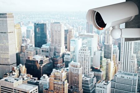 3D Rendering of a white CCTV security camera on modern city background with copy spaceの写真素材