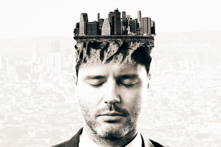 Portrait of thoughtful businessman with abstract cityscape on head. Research concept. Double exposureの写真素材