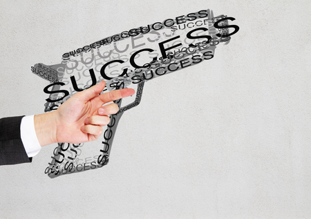 Businessman's hand with abstract gun sketch. Success concept