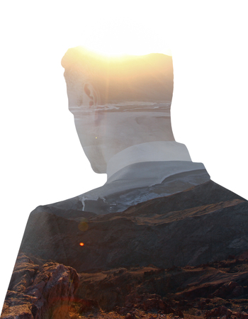 Back view of young businessperson on landscape background with sunlight. Research conceptの写真素材