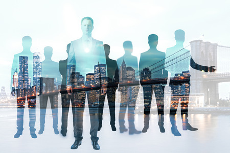 Crowd of businessman silhouettes on abstract city background. Meeting concept. Double exposure