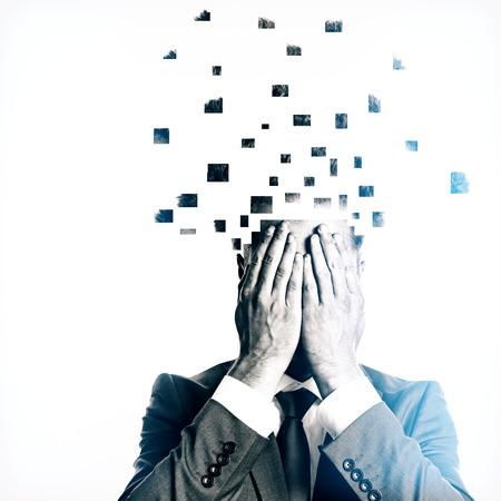 Businessman with broken into pieces head on light background. Overworked conceptの写真素材