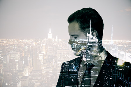 Side view of thoughtful young businessman on abstract city background with copy space. Double exposureの写真素材