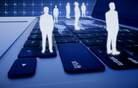Abstract human icons on laptop keyboard with map. HR, global business and technologies conceptの写真素材