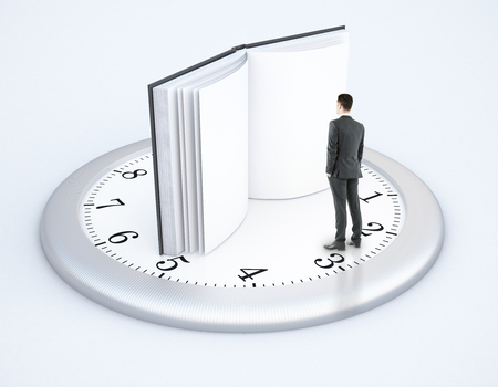 Tiny businessman standing on clock with open book instead of arrows on light background. 3D Renderingの写真素材