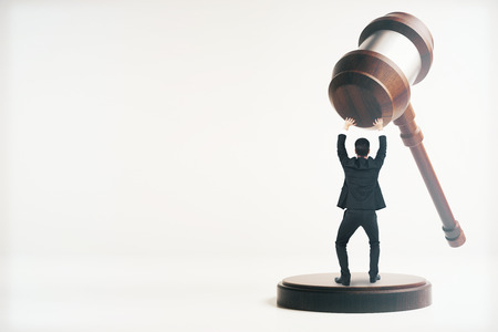 Tiny man holding wooden gavel on white background with copy space. 3D Renderingの写真素材