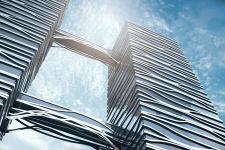 Creative contemporary skyscraper on bright sky background. Bottom view. 3D Renderingの写真素材