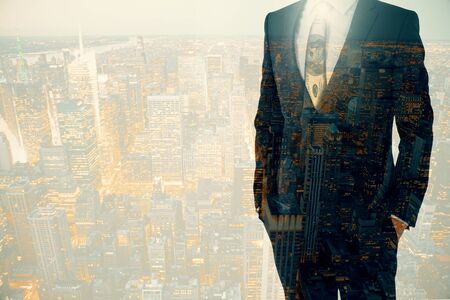 Businessperson in suit on city background with copy space. Double exposure.の写真素材