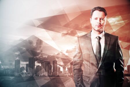 Portrait of handsome young businessman on abstract red polygon city background. Success concept. Double exposureの写真素材