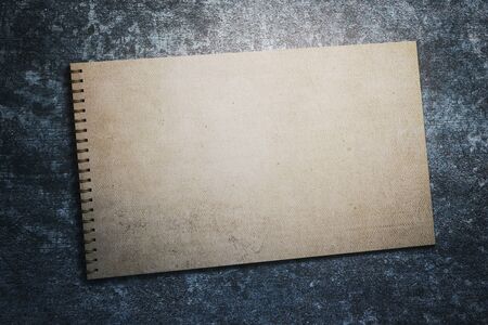 Top view of aged spiral notepad on textured background. Mock up, 3D Renderingの写真素材