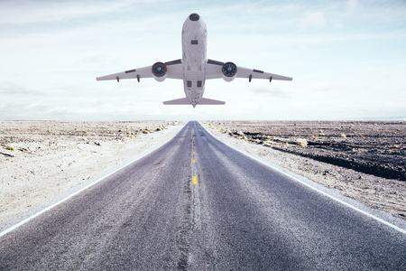 Taking off airplane on runway and desert background. Travel concept. 3D Renderingの写真素材