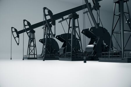 Side view of dark oil derricks on light background. Petrol concept. 3D Renderingの写真素材