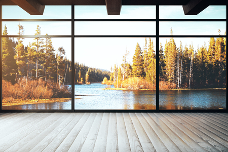 Loft interior with panoramic autumn landscape view. Beauty concept. 3D Renderingの写真素材