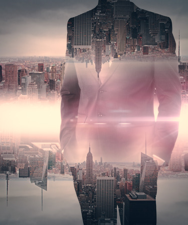 Businessman on creative upside down red city background. Double exposureの写真素材