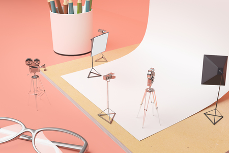 Creative tiny photo studio made out of supplies: white paper, coffee cup, pencils, glasses and other items on peachy background. Side view, 3D Renderingの写真素材