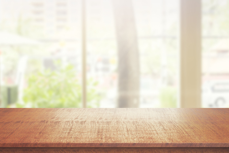Close up of wooden desk on blurry background. Ad concept. Mock upの写真素材