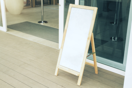 Close up of blank white menu board on cafe verandah. Mock upの写真素材