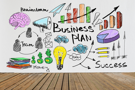 Interior with wooden floor and business sketch on concrete wall. Success conceptの写真素材