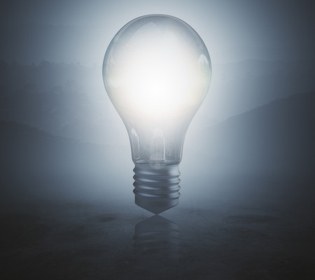 Glowing lamp on blurr gray background. Idea concept. 3D Renderingの写真素材