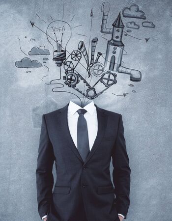 Headless businessman standing on concrete background with business sketch. Plan conceptの写真素材