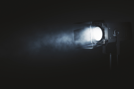 Spotlight on dark smoky background. Professional lighting equipment concept. 3D Renderingの写真素材