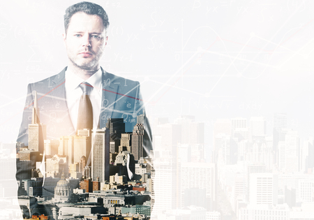 Portrait of handsome young european businessman standing on abstract city background with mathematical formulas. Employment and education concept. Double exposure の写真素材