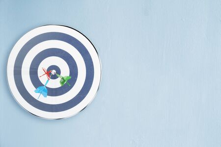 Dartboard on concrete background. Targeting and aiming concept. 3D Rendering の写真素材