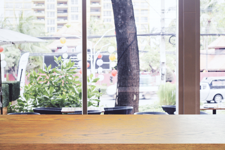 Empty wooden counter on cafe background. Montage concept, Copy spaceの写真素材