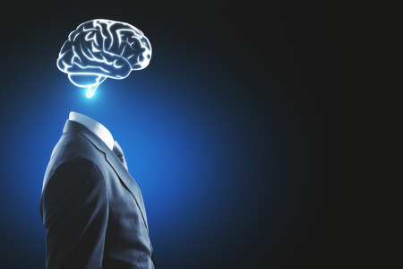 Side view of glowing brain headed businessman on blue background with copy space. Brainstorm and...