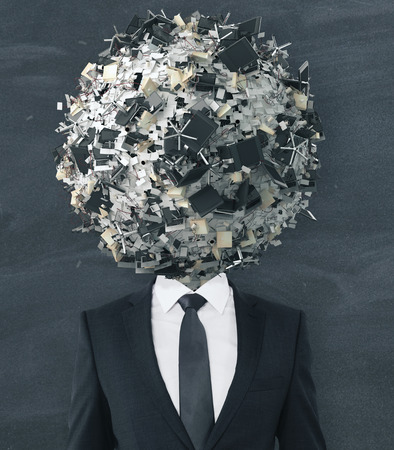 Businessman with abstract office items and equipment ball head on chalkboard background. Confusion concept の写真素材