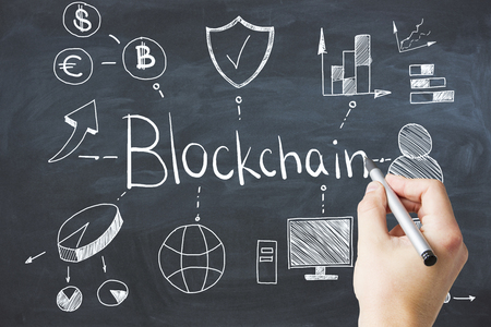 Hand drawing abstract blockchain doodle on chalkboard wall background. Cryptocurrency concept の写真素材