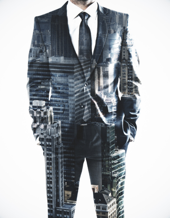 Businessman standing on abstract city background. Research and employment concept. Double exposure の写真素材