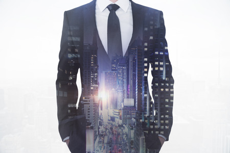 Businessman on night city background. Career and employment concept. Double exposure の写真素材