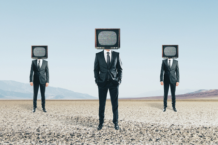 TV headed people standing on abstract landscape background. Brainwash and manipulation concept の写真素材