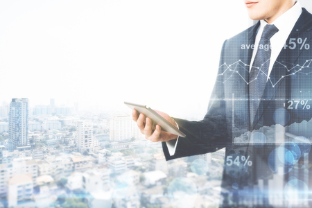 Side view of young businessman using mobile phone on abstract city background with copy space. Technology and communication concept. Double exposure の写真素材