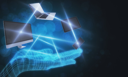 Digital grid hand holding devices on blurry background. Technology and cloud network concept. 3D Renderingの写真素材