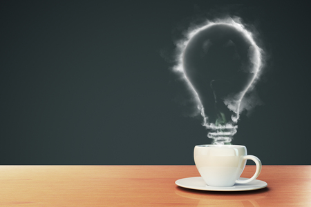 coffee makes the idea concept with smoky light bulb in white cup on light wood table. 3D renderingの写真素材