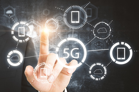 Businessman hand pointing at 5G hologram. Online and speed concept. Double exposure